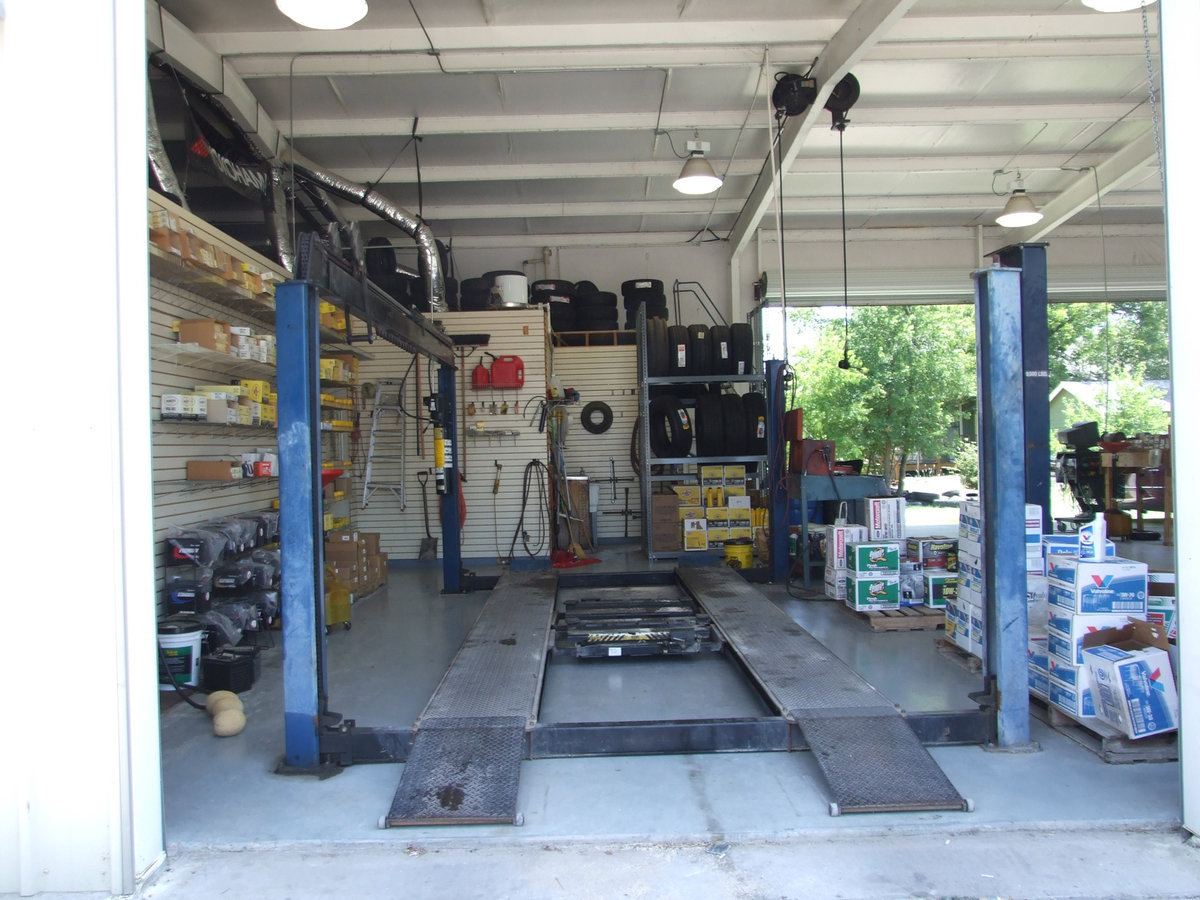 Image: Automobile lift — Pretty impressive shop.