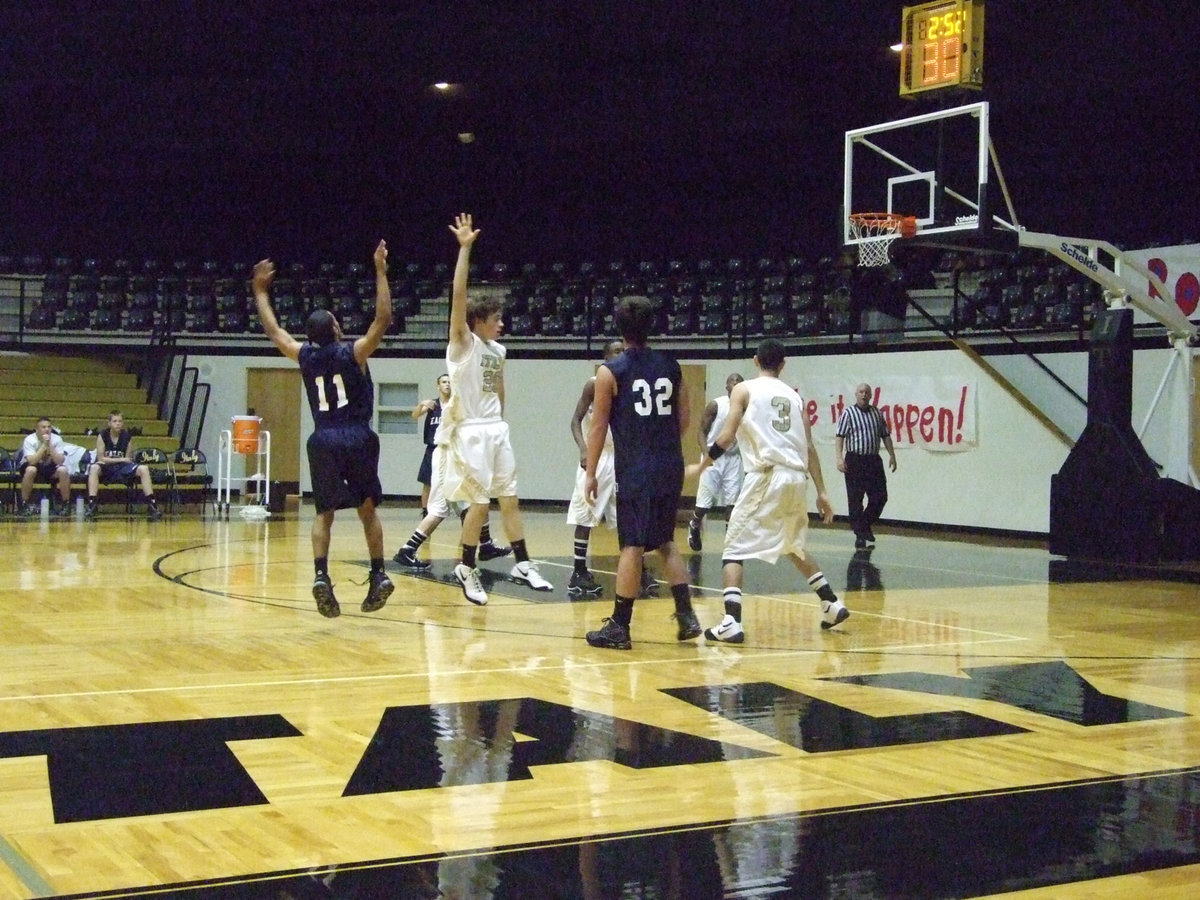 Image: Crownover Challenges — Dan Crownover #20 challenges an Eagle shooter.