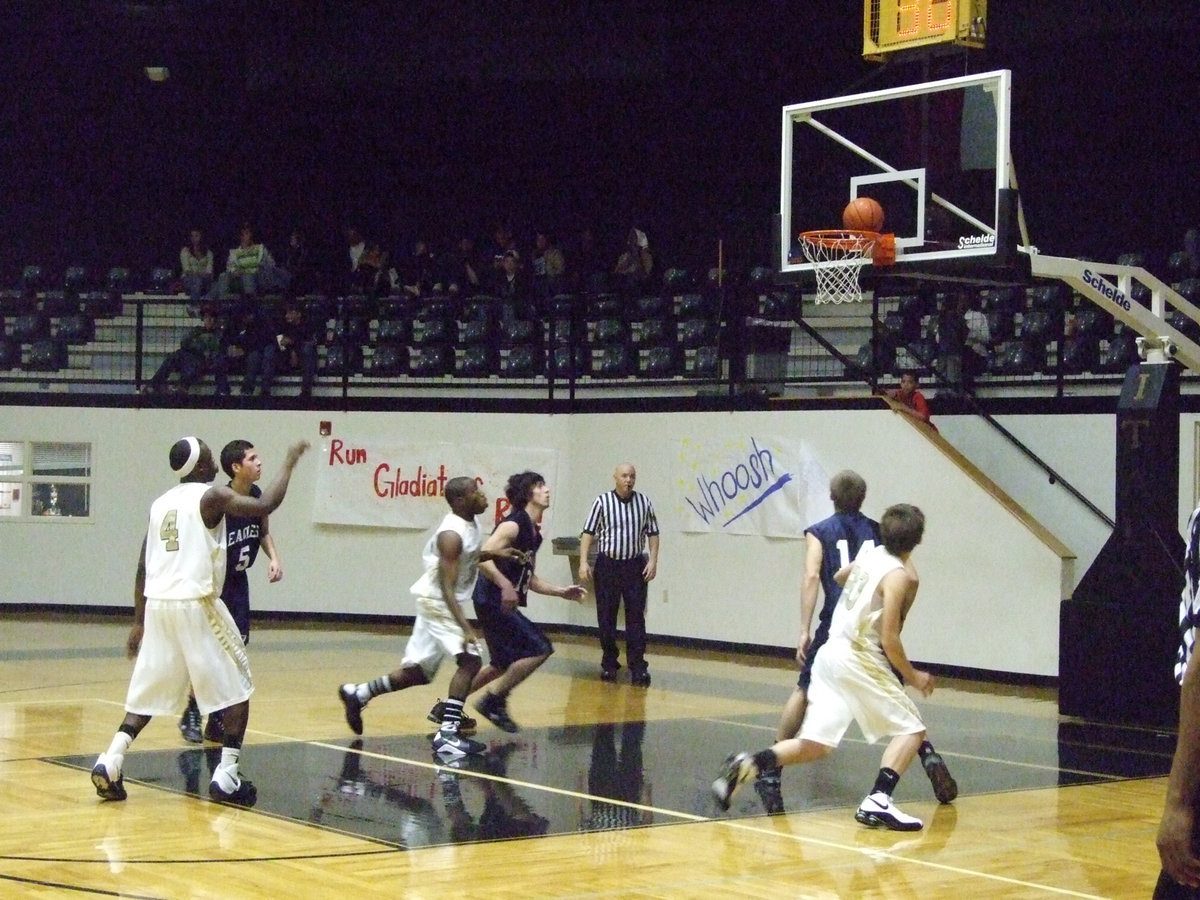 Image: Rodgers From The Line — Desmond Anderson #15 and Dan Crownover #20 go for the rebound just in case Diamond’s shot rims out.