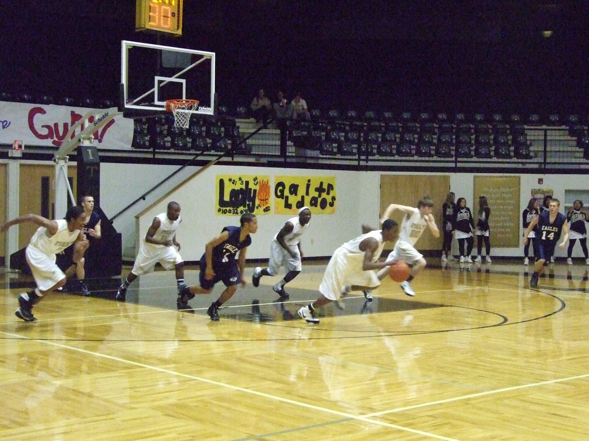 Image: Seniors Lead — Playing their final regular season game as Italy Gladiators, Seniors Dontavius Clemons #5, Diamond Rodgers #4 and Darrin Moore #33 lead the charge into the playoffs.