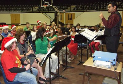 Image: Jesus Perez directs — Mr. Perez leads the 7th Grade Band during their performance.