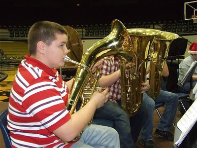 Image: Kelton plays on — Kelton Bales helps the 7th Grade Band put on a great show.