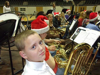 Image: Bailey and the band — 8th grader Bailey Walton gets ready to ring in the Holidays with the Gladiator Regiment Band.