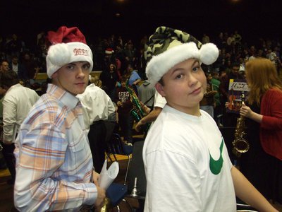 Image: Justin and Zain — Justin and Zain had the Holdiay spirit with their creative Claus caps.