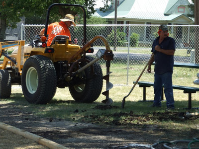 Image: Let’s Dig A Hole — Home Depot employee digging holes.