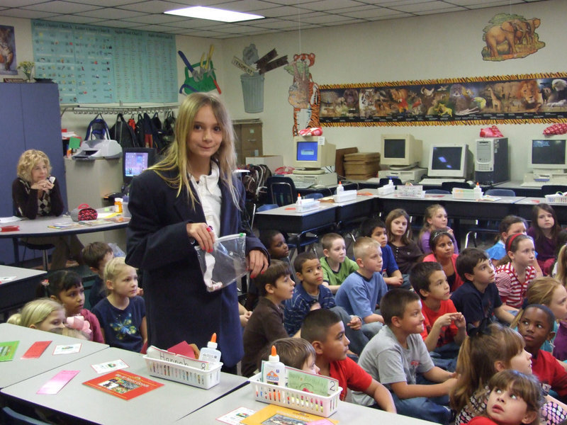 Image: Students Learning about Lincoln — Cassidy Svehlak said, " We are reading books to the little ones for President Lincoln’s 200th birthday and we passed out pennies so the kids could see President Lincoln’s face on the penny."