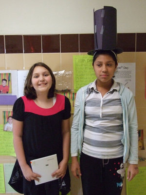 Image: Megan and Julissa — Megan Dorsil (sixth grade) and Julissa Hernandez (fifth grade) said, “We are pretending to be Abe Lincoln and reading Abraham Lincoln books to the younger kids.”