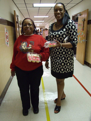 Image: It’s All About Cupcakes — Kathy Hodge and Felicia Burkhalter helping to pass out cupcakes too!