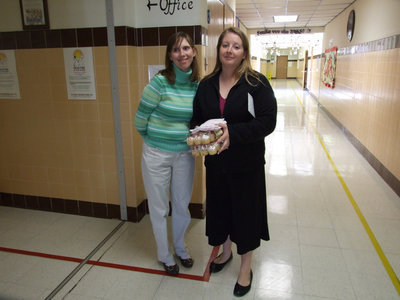 Image: More Cupcakes — Kelly Svehlak (parent) and Misty Escamila (Resource Teacher) also are ready to pass out the cupcakes.