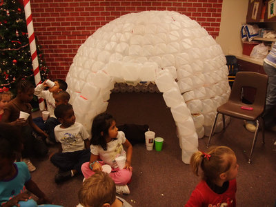 Image: Big Igloo — Jennifer Aguado (Pre-K teacher) said, “My husband, Tony Aguado and I built this igloo this year. It took about 500 plastic jugs. Tony is is 6’3 and can lay across it inside. A lot of kids can fit in it at a time and they just love it.”