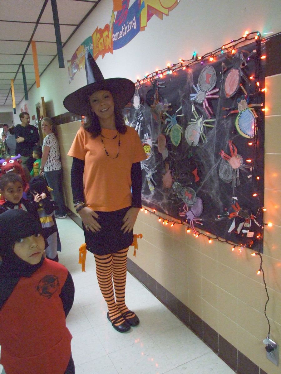 Image: Witch surrounded by spiders