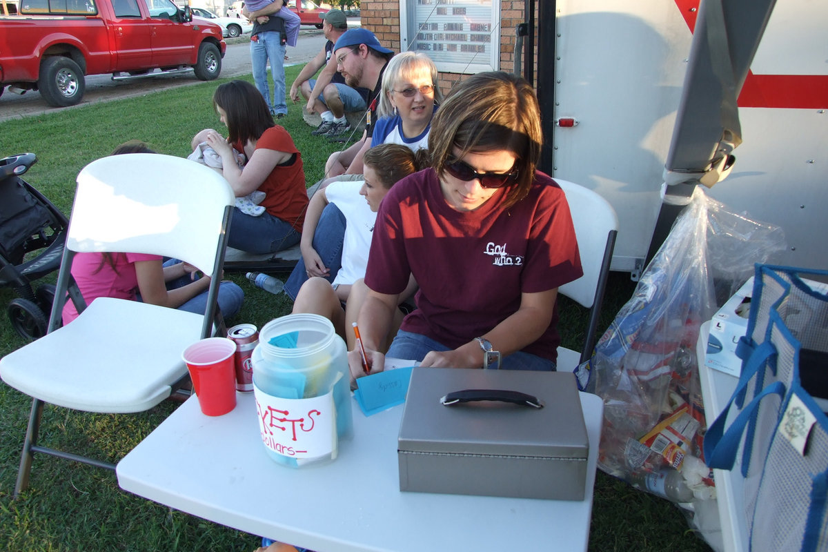 Image: Jenna Chambers — FBC member, Jenna Chambers, takes tickets and money for the youth group.