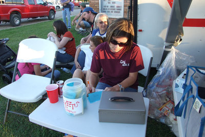 Image: Jenna Chambers — FBC member, Jenna Chambers, takes tickets and money for the youth group.