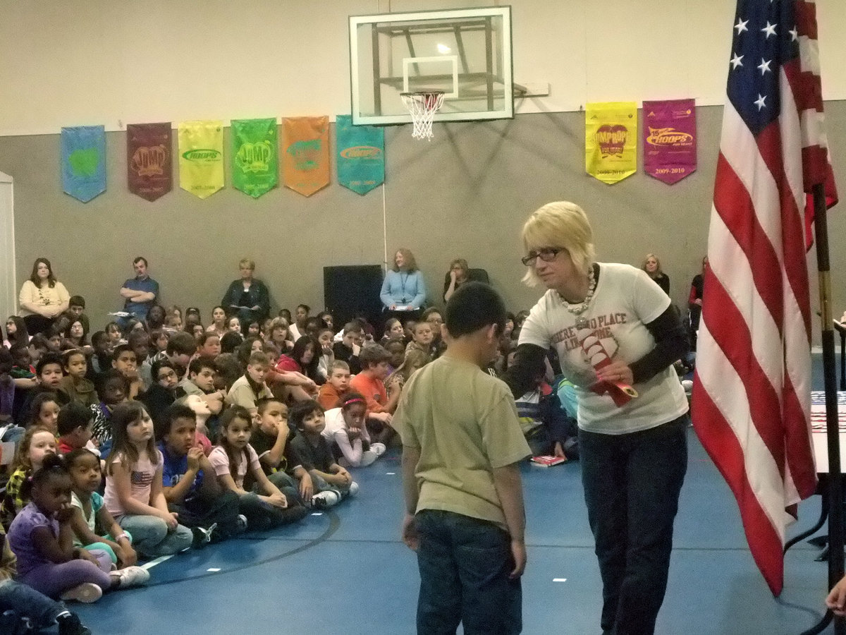 Image: Red Ribbon — This young man was accepting his award for all A’s and B’s.