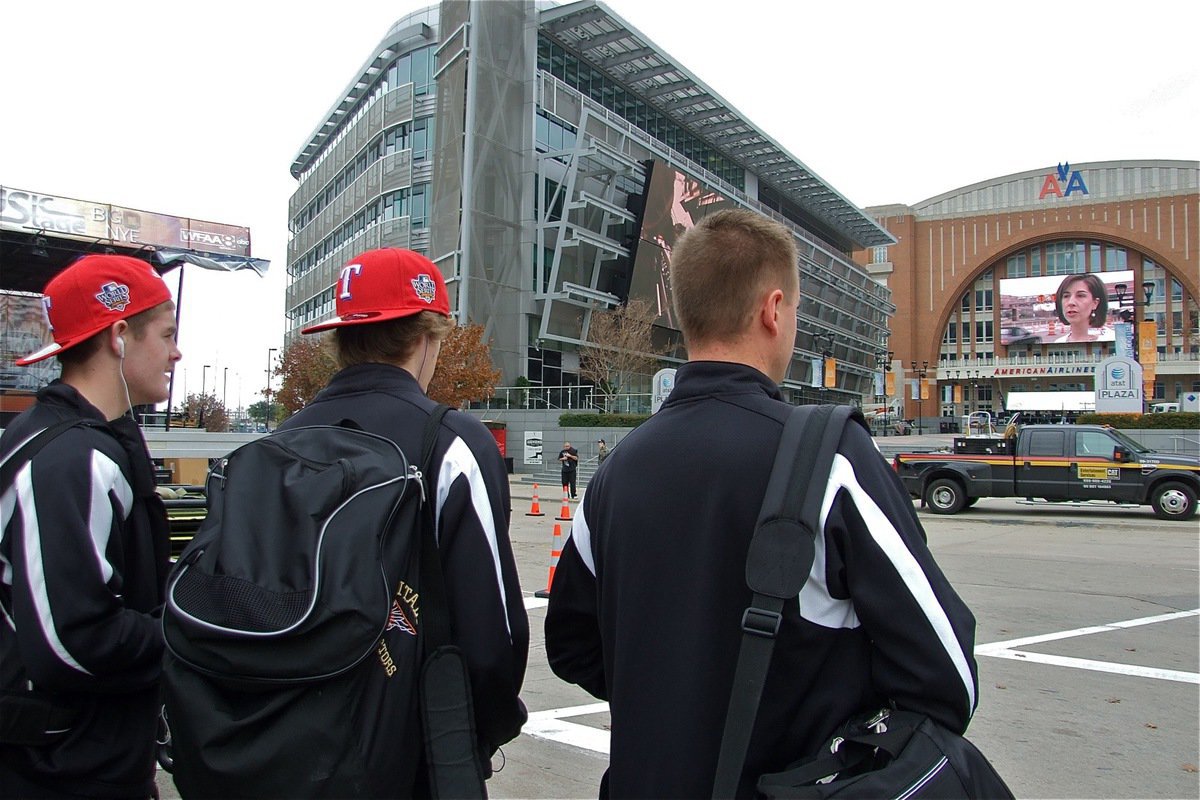 Image: The Gladiators make their way to the American Airlines Center — Italy Gladiator basketball players Ryan Ashcraft and Colton Campbell, along with their head coach Aidan Callahan, take a moment to absorb the fact their about to play inside the American Airlines Center, home of the Dallas Mavericks.