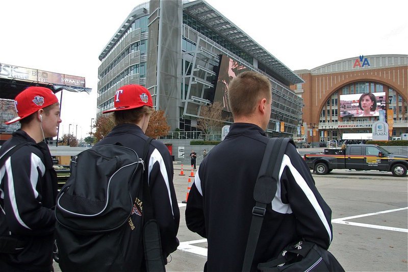 Image: The Gladiators make their way to the American Airlines Center — Italy Gladiator basketball players Ryan Ashcraft and Colton Campbell, along with their head coach Aidan Callahan, take a moment to absorb the fact their about to play inside the American Airlines Center, home of the Dallas Mavericks.
