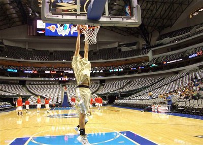 Image: Cole’s jamming — Italy’s Cole Hopkins rocks the AAC rim before the game against the Mineral Wells Rams.