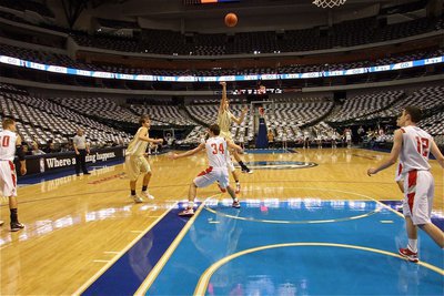 Image: Dirk-like form — Resembling the Mavericks’ Dirk Nowitzki, Colton Campbell(5) gets off a shot as Cole Hopkins(21) heads toward the basket.