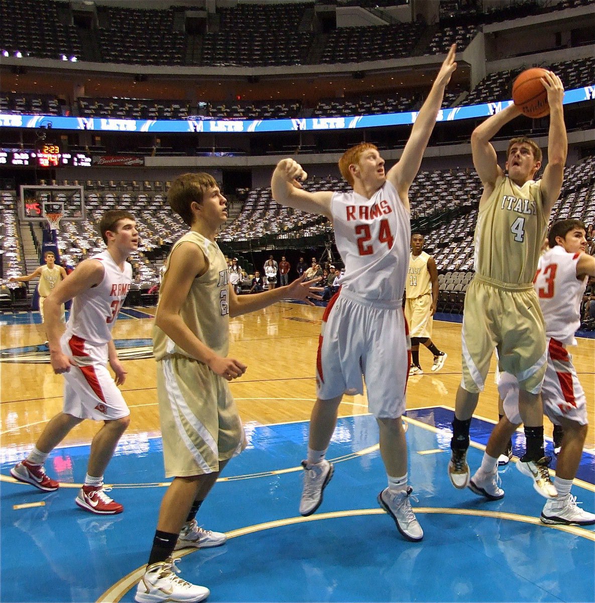 Image: Ashcraft underneath — Italy’s Ryan Ashcraft(4) goes up for a bucket with Mineral Wells’ Matt Tincher(24) defending.