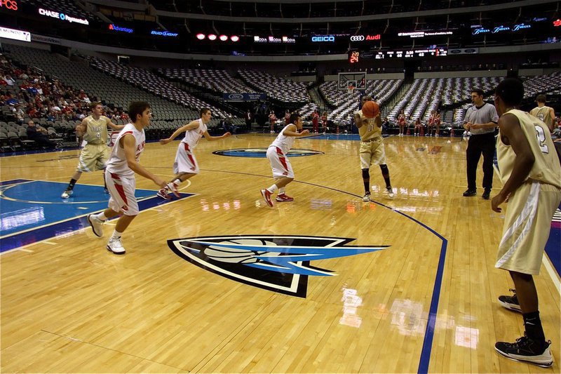 Image: Passing to the wing — Heath Clemons(2) awaits a pass from teammate Jasenio Anderson(11).