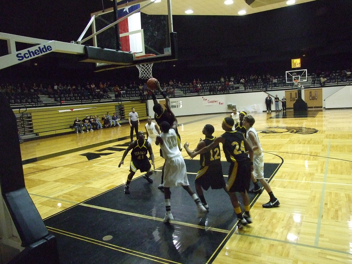 Image: Isaac  — Italy’s John Isaac #10 tries to get a Wampus Cat down from the net.