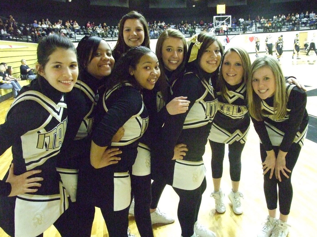 Image: Staying warm — The Italy Cheerleaders try to stay warm during Italy’s cold shooting night against Itasca.