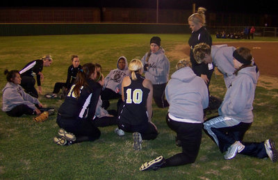 Image: Coach Reeves addresses the team — Coach Reeves and her Lady Gladiators where all smiles after the game.