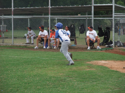 Image: J.B. smacks one — John Byers #12 of Italy hits a fly ball to right field.