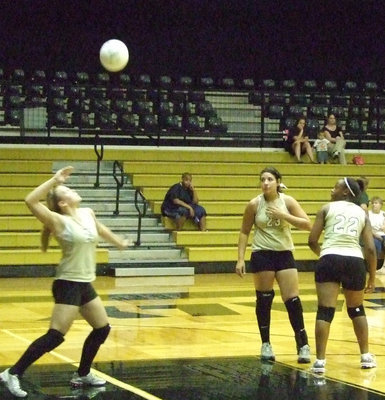 Image: Serve it up — Casi Jeffords serves the ball to Maypearl.
