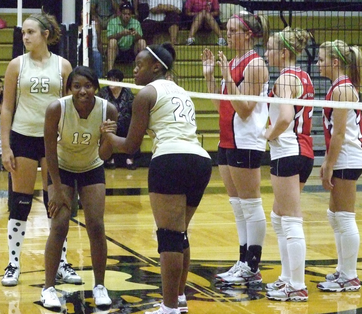 Image: Get ready — Brianna Burkhalter (BB) and Chante Birdsong get ready to switch with our big middle.  Brianna Perry watches the serve.