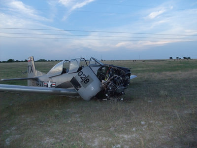 Image: Under the wire — The aircraft skidded to a stop beneath power lines.