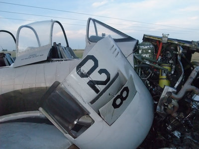 Image: Sideview of cockpit — The windows did not shatter but the pilot received a gash on his head.