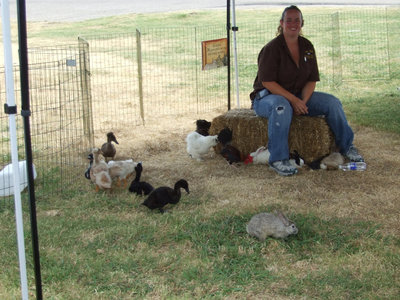 Image: Paige Guardiola and Her Zoo — Paige Guardiola is the owner of Ewe Pet Petting Zoo and Pony Rides. Here she is with some of her animals.