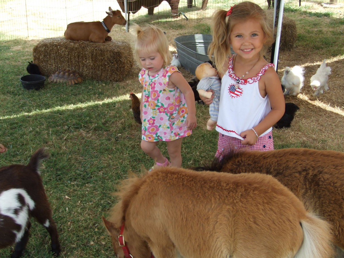 Image: Hope and Grace Humphry — These sisters took a break from traveling and were enjoying the zoo.