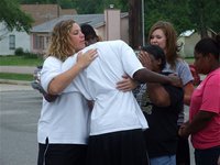 Image: Hugs all round for John Isaac before he leaves for Austin — Lady Gladiator basketball coach Stacy McDonald, IHS faculty member Brenda Davis, and IHS students Sa’Kendra Norwood and Kaitlyn Rossa offer hugs and words of encouragement before John journeys to Austin to compete in the triple jump at State.