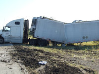 Image: Truck Split in Half — This truck looks to be split in half after being flipped.