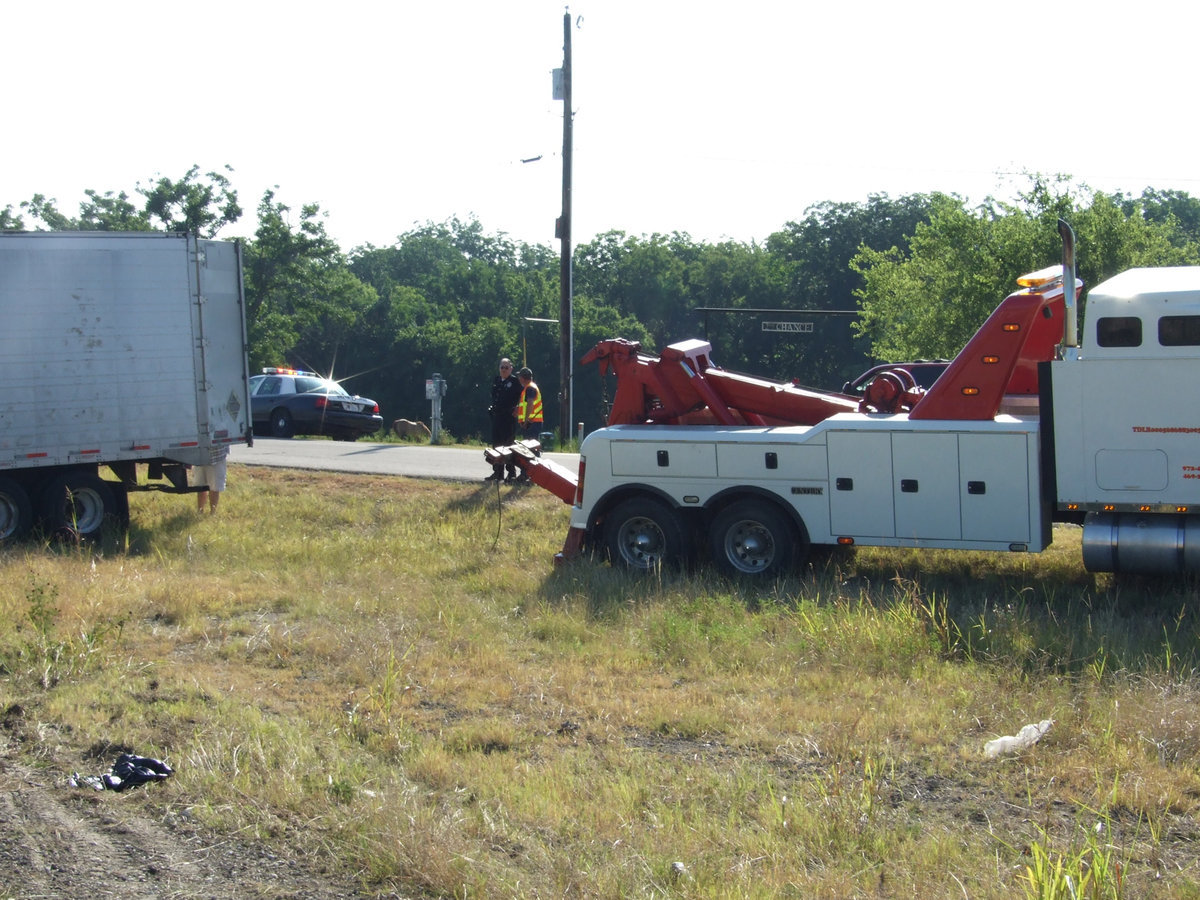 Image: On the Scene — It took two heavy duty wreckers to up right the eighteen wheeler.