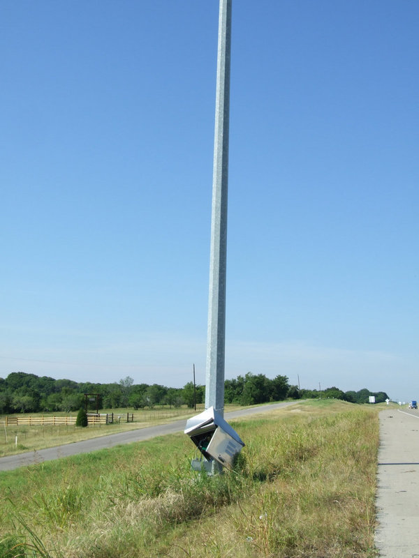 Image: TEX Dot Camera Pole — The truck hit the TEX Dot camera pole and knocked off the camera.