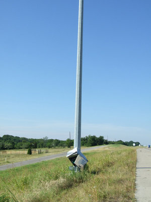 Image: TEX Dot Camera Pole — The truck hit the TEX Dot camera pole and knocked off the camera.