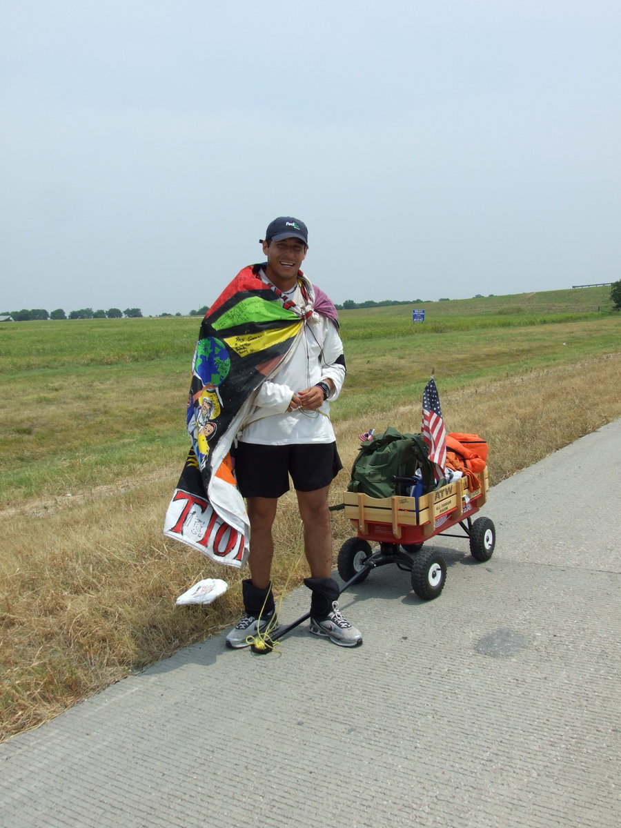 Image: He gets attention — His cape and wagon brings him lots of attention and allows him to meet and talk to tons of people.