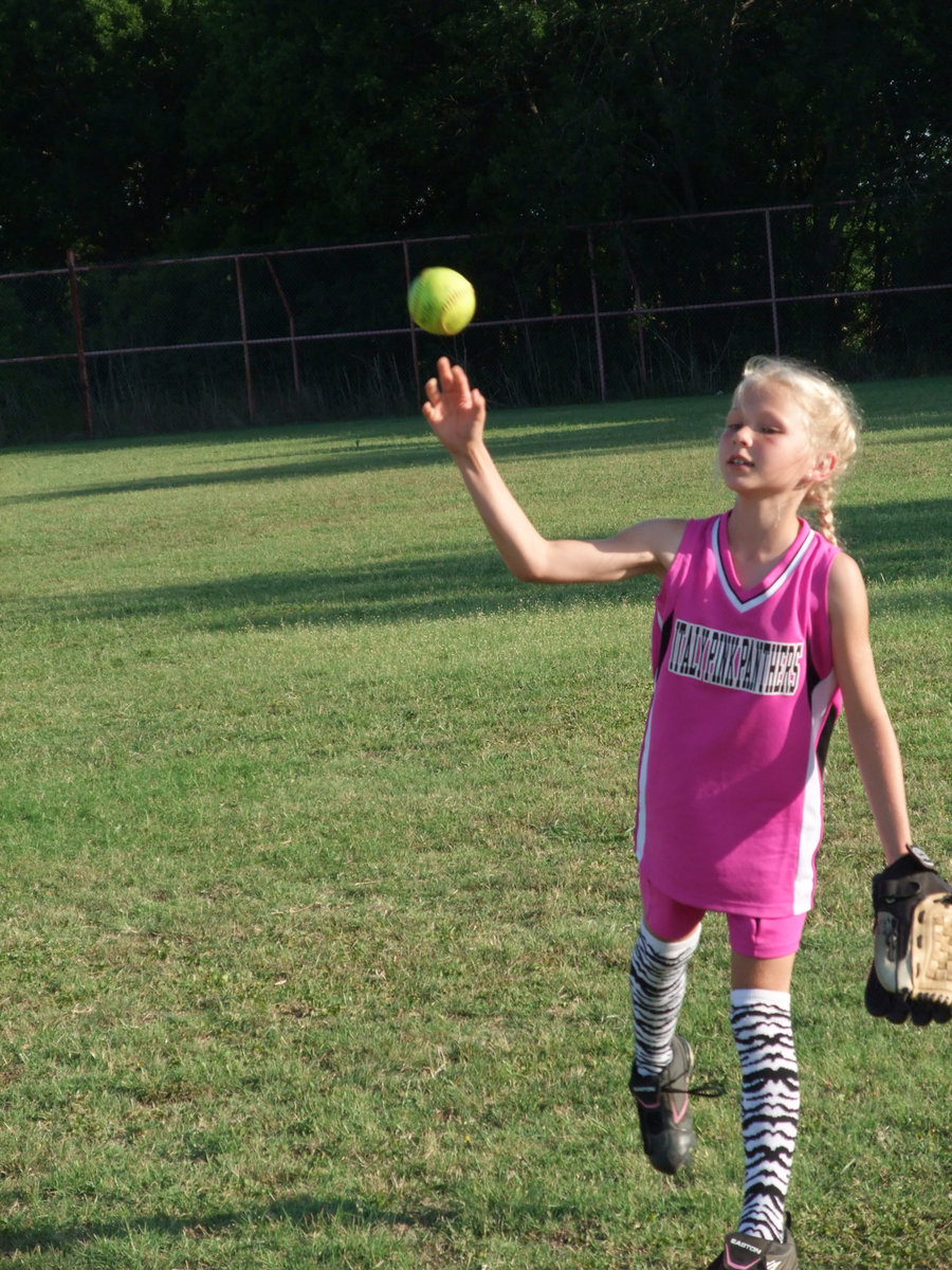 Image: Taylor is swift — Taylor Boyd warms up under the June sun before taking on the Milford Bulldogs.