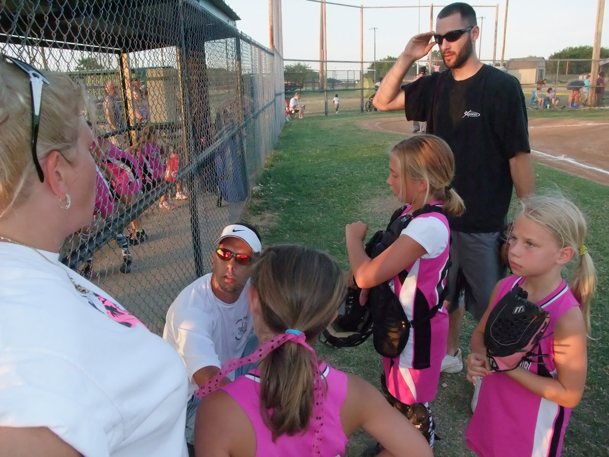 Image: Coaches discuss — Coaches discuss which coach has the coolest shades.