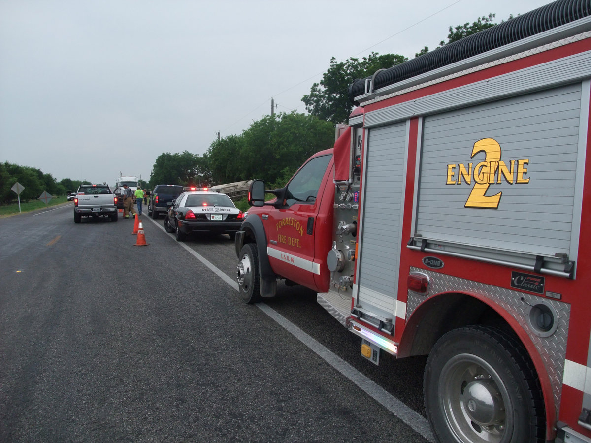 Image: Emergency response — The Forreston Fire Department was on scene early along with DPS troopers to help slow traffic and make sure the 18-wheeler’s leaking gas tank was contained.