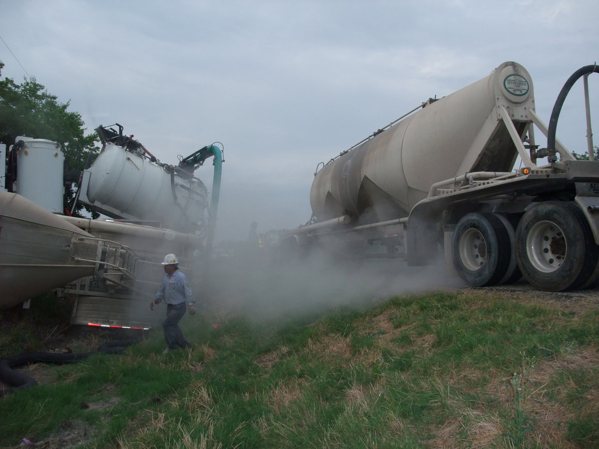 Image: That’s not smoke — A powdered cement mix fogged the banks of the scene and made it difficult for traffic to pass safely.