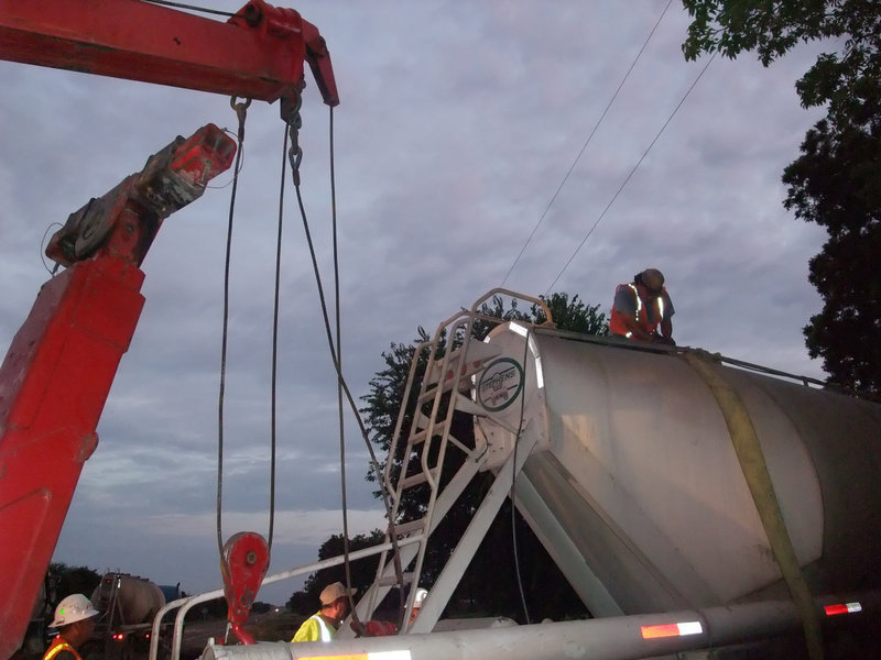 Image: Uprighted — All is well as the tow teams were able to keep the trailer from sustaining any more damage while being lifted back onto the roadway.