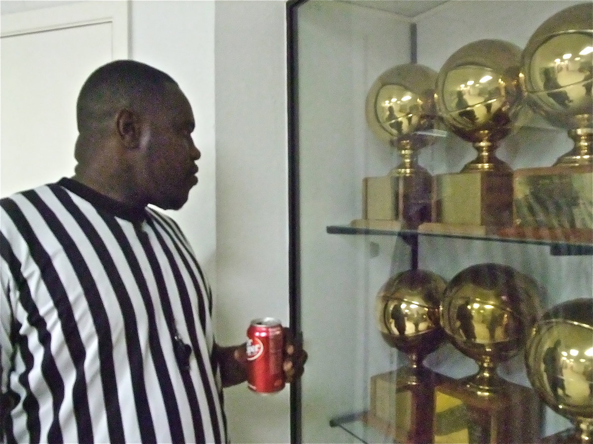 Image: Donald Pice drinks D.P. — One of Italy’s living legends, Donald Price, has a Dr. Pepper while reminiscing and reading the playoff trophies he helped collect for the Gladiators.