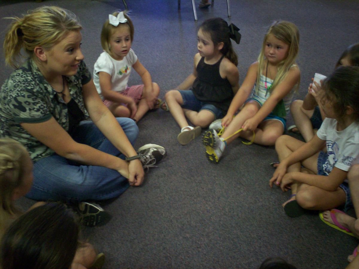 Image: Circling the troops — This adorable little regiment of Bible Soldierettes try keeping their ribbons in their hair and their laces tied while learning about the Lord.