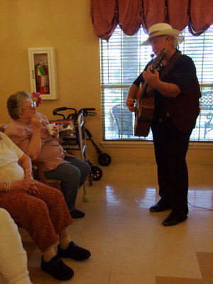 Image: Singing to the ladies — Clyde is having fun singing to the ladies.