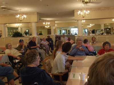 Image: Residents enjoying ice cream — The residents are enjoying eating ice cream and listening to Clyde.