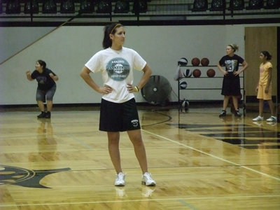 Image: Coach Megann Lewis — Former Lady Gladaitor basketballer, AKA Coach Megann Lewis, oversees dribbling drills during camp on Tuesday.